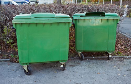 Workers loading a van with mixed commercial waste in a central London street